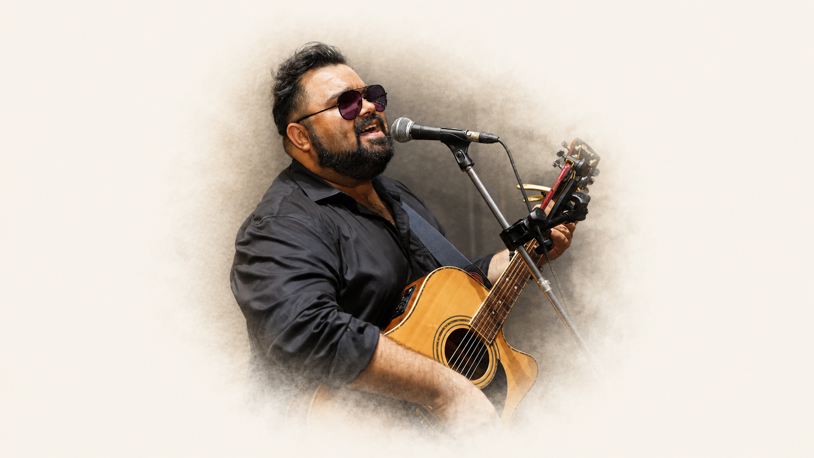 Ankur Anil Sharma performing original music with acoustic guitar